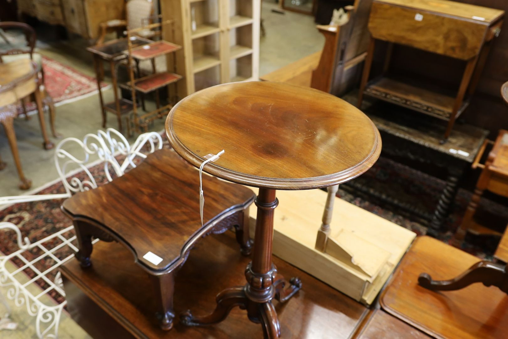 A Victorian mahogany circular wine table, a Pembroke table and a small carved mahogany low table